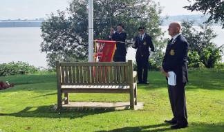 Image:Nautilus Mariners' Park. (L-R) Bernard Smith, secretary of Wirral MNA raising the flag; Robert Parson, standard bearer, and Arthur Speed, chair of Wirral MNA (foreground). Image: Nautilus International