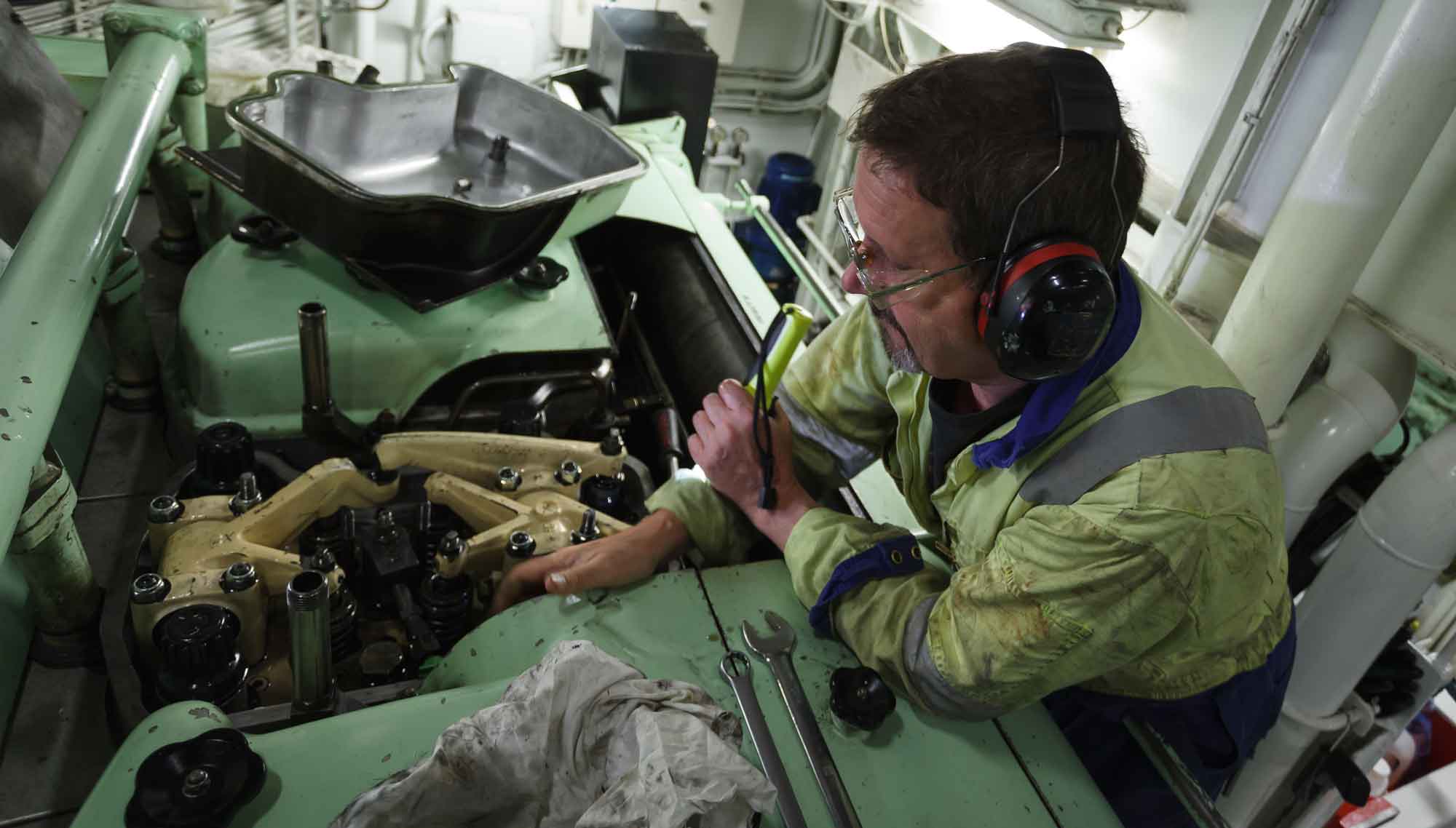 A marine engineer works on a ship's engine. Image: Getty Images. Image:A marine engineer works on a ship's engine. Image: Getty Images.