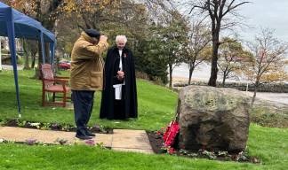 Image:A salute from Richard Mitchell after laying a wreath on behalf of Merchant Navy Association. 