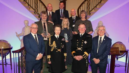 Image:Iain Lindsay, (back, top left), was honoured with a MNWB award (Team Member of the Year) for services to seafarer welfare. The other recipients were: Back (L-R beside Mr Lindsay): Alexander Campbell; CEO Queen Victoria Seafarer's Rest (Innovation Award); Peter Wells of the Seafarers' Christian Friend Society (Volunteer of the Year Award). Middle (L-R): John Cousley of the Department for Transport (Most Collaborative Organisation); Sandra Welch, CEO of the Seafarers Hospital Society (Lifetime Achievement Award); Vikki Muir, head of Charitable Giving at Trinity House (Team Member of the Year). Front (L-R): Stuart Rivers, chief executive of the MNWB; HRH The Princess Royal, (patron of the MNWB); Captain Sir Ian McNaught, MNWB president; Captain Andrew Cassels, MNWB chair. Images: Mark Dalton