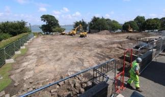 The cleared site with views towards the River Mersey. The hedge visible at left runs beside Manor Lane, used to access the promenade. Image: Time-lapse Manchester Image:The cleared site with views towards the River Mersey. The hedge visible at left runs beside Manor Lane, used to access the promenade. Image: Time-lapse Manchester